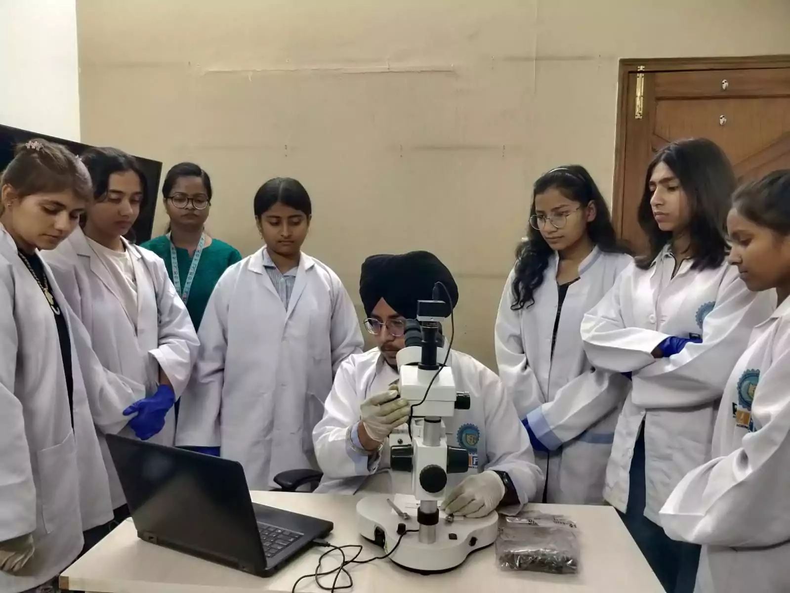 Students conducting detailed forensic examination using a Stereozoom Microscope during their visit to Sherlock Institute of Forensic Science (SIFS).
